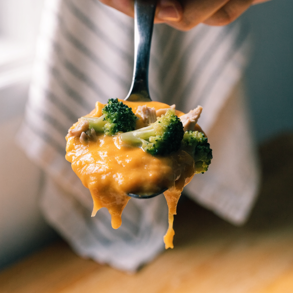 Close-up of broccoli cheddar soup with shredded chicken and greek yogurt